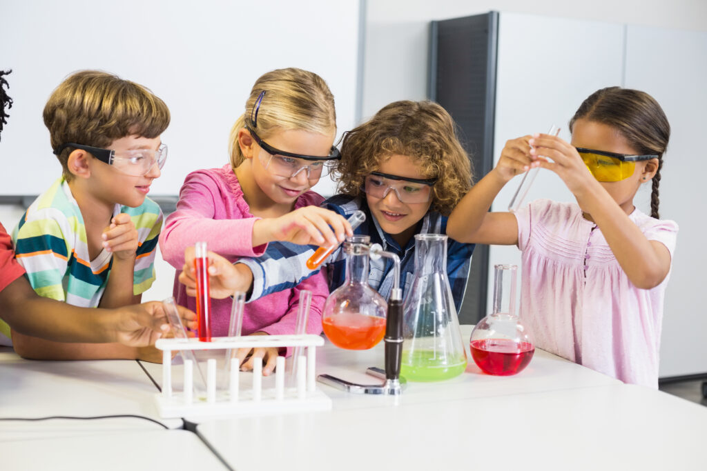 Kids,Doing,A,Chemical,Experiment,In,Laboratory,At,School