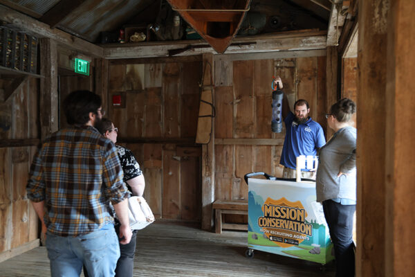A staff member gives onlooking guests a demonstration.