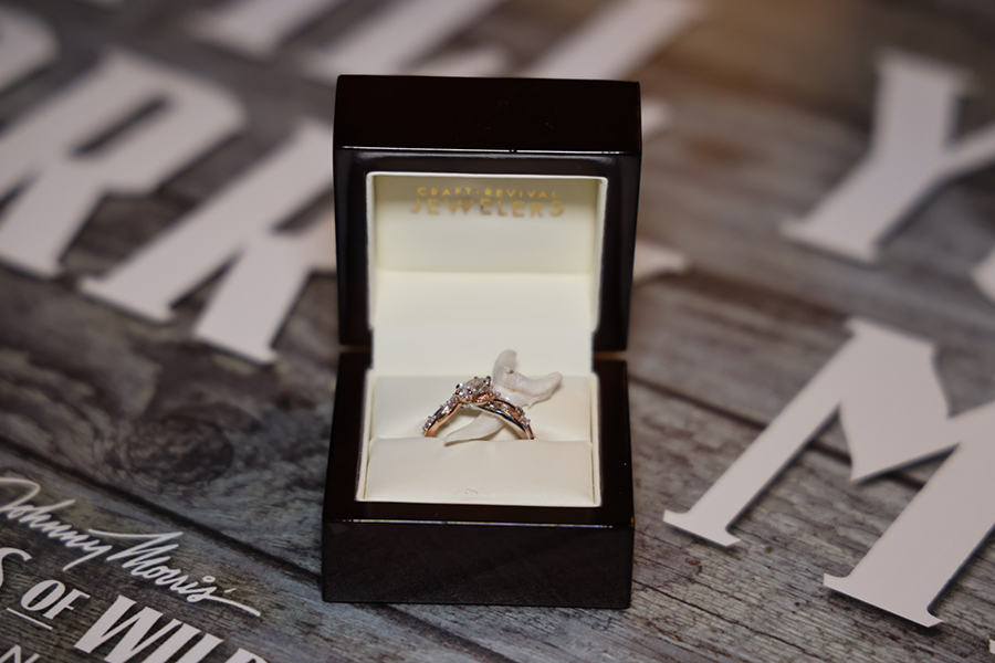 A beautiful engagement ring in a black box.