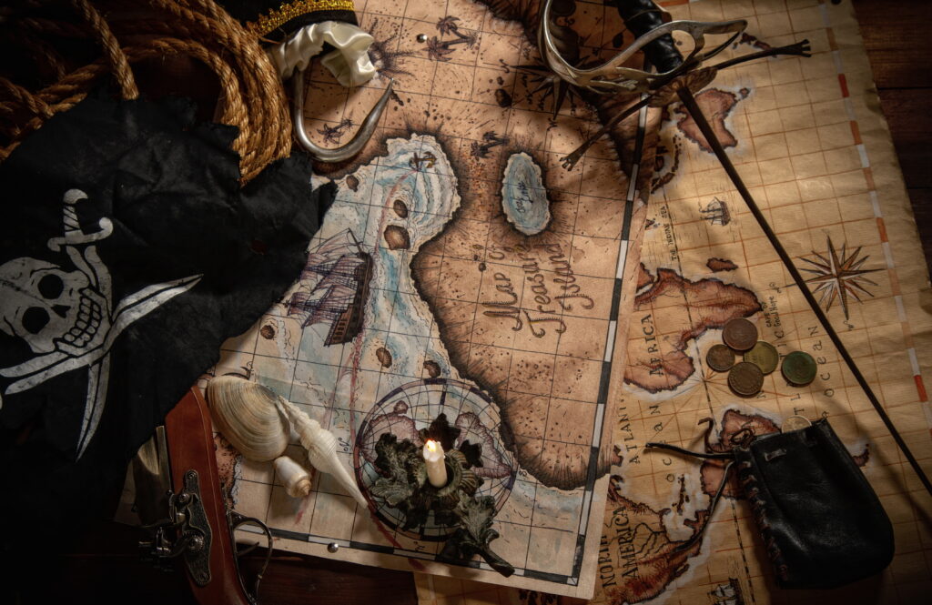 Items from pirated goods randomly laid out on the old ship's table